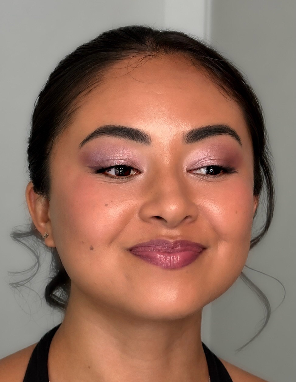 Lavender shimmer eyeshadow with a glowing complexion and a soft mauve lip